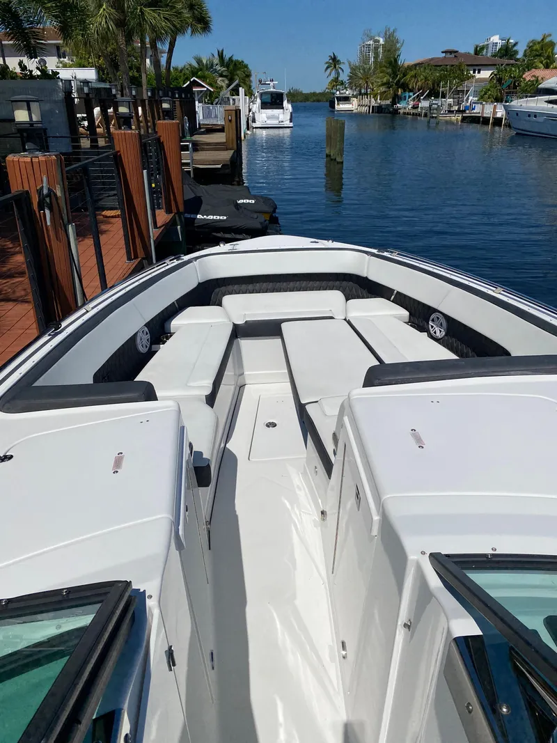 Slide: The Image of 2019 Monterey 378 Super Express boat docked in a marina. - 23