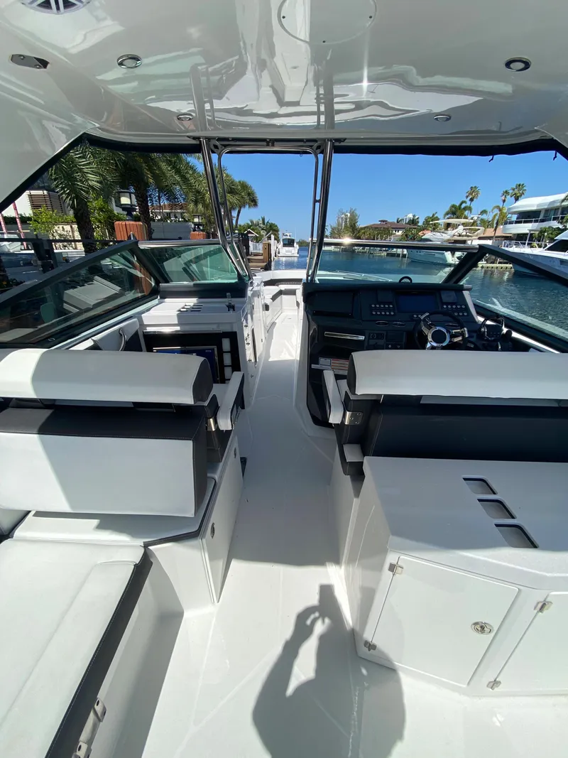 Slide: The Image of 2019 Monterey 378 Super Express boat interior with seating and dashboard. - 24