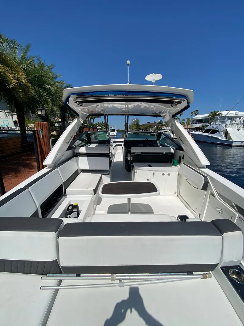 Slide: The Image of 2019 Monterey 378 Super Express boat interior with seating and open deck. - 25
