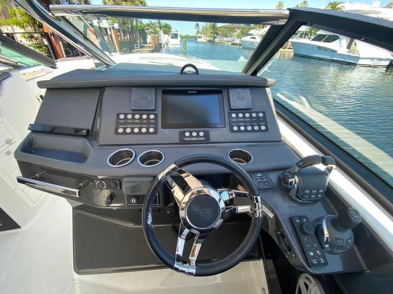 Slide: The Image of 2019 Monterey 378 Super Express boat helm with modern controls and navigation system. - 27