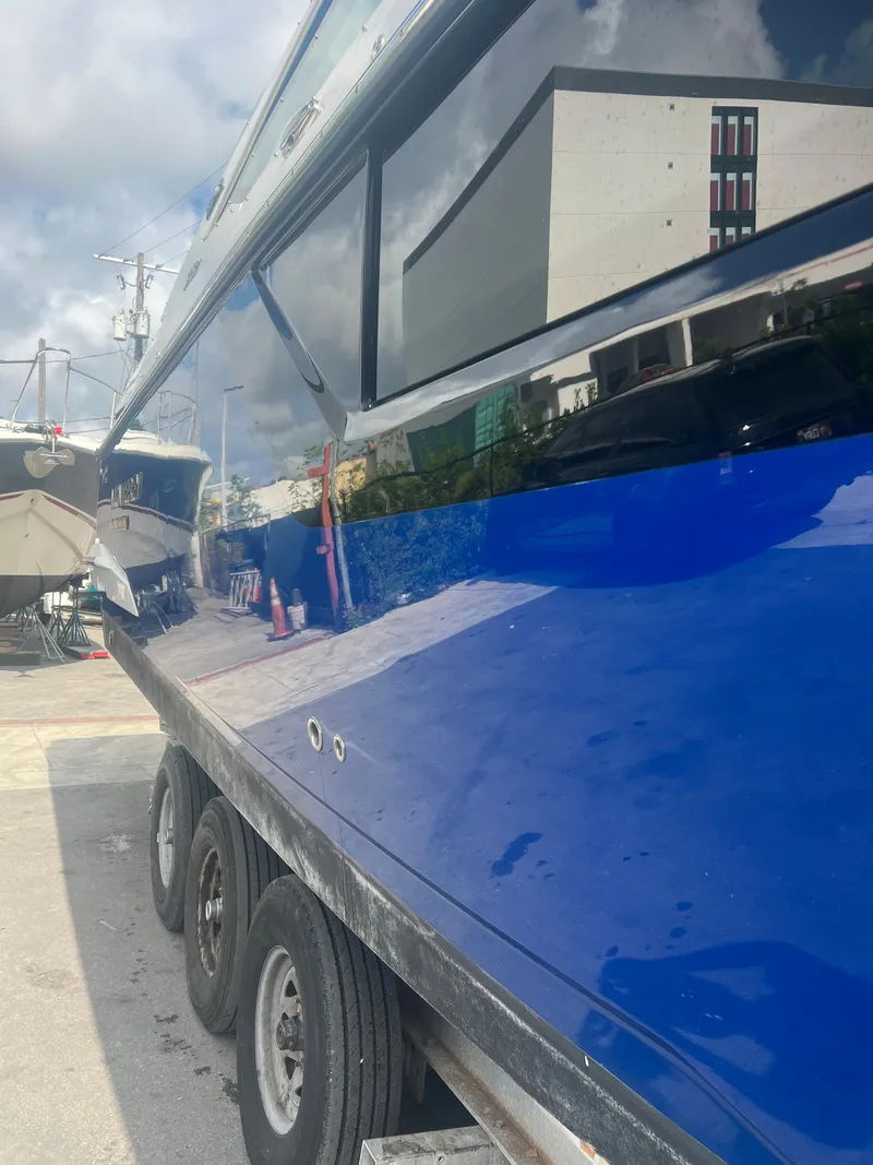 Slide: The Image of 2019 Monterey 378 Super Express boat on a trailer, side view. - 5