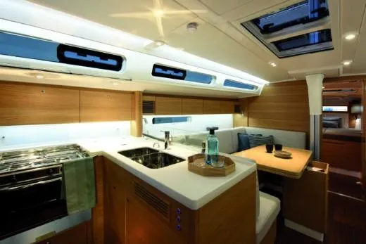 Slide: The Image of Luxurious interior of 2025 X-Yachts Pure X-4.3, featuring modern kitchen and dining area. - 14
