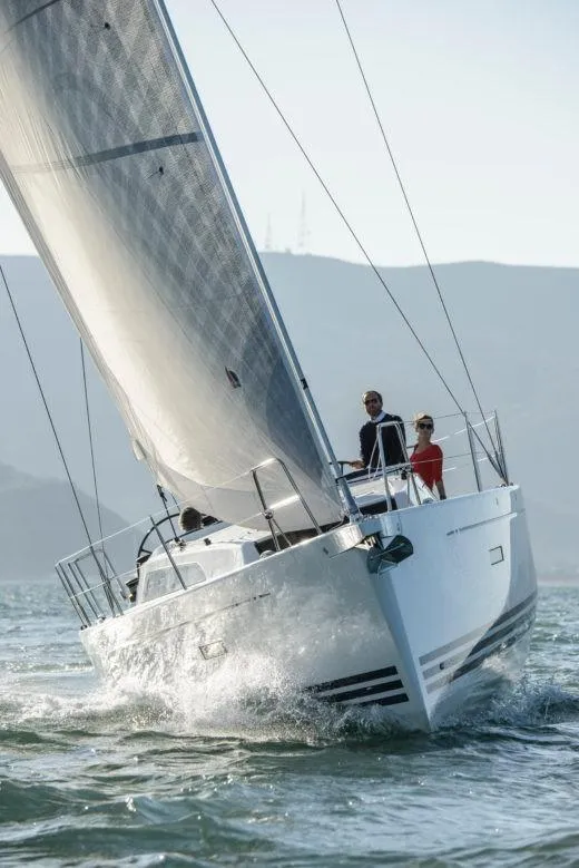 Slide: The Image of 2025 X-Yachts Pure X-4.3 sailing on open water, showcasing sleek design and performance. - 5