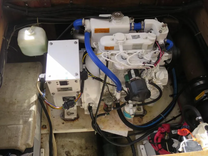 Slide: The Image of 1999 Eastern 35 engine compartment with wiring and components. - 10