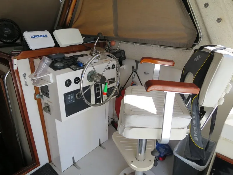 Slide: The Image of Helm station of a 1999 Eastern 35 boat with captain's chair and navigation equipment. - 5