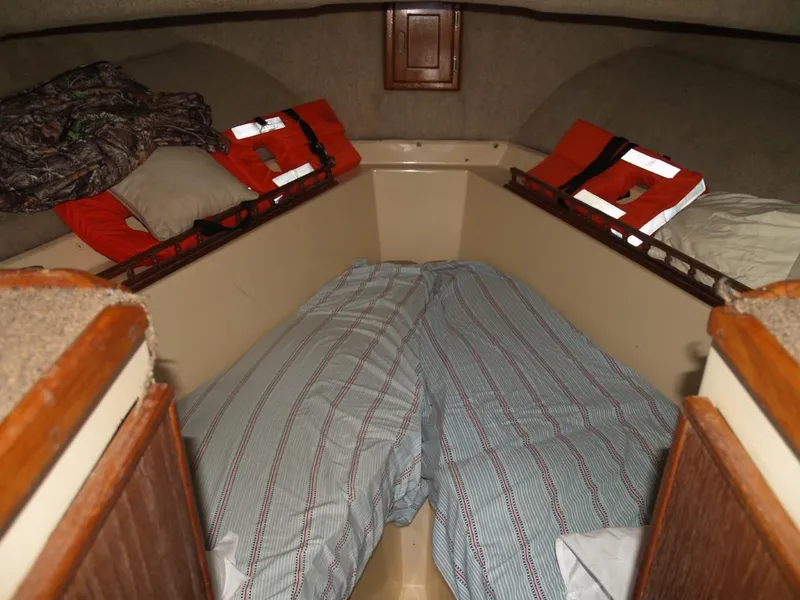 Slide: The Image of 1999 Eastern 35 boat cabin with twin beds and life jackets - 8