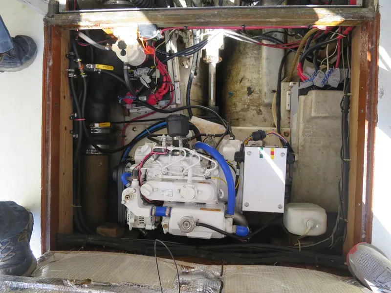 Slide: The Image of 1999 Eastern 35 boat engine compartment with wiring and mechanical components. - 9