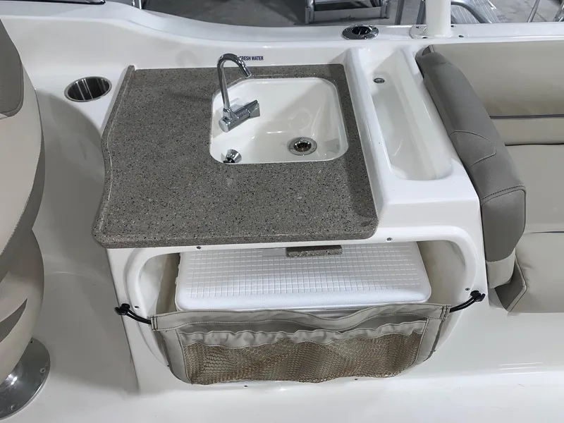 Slide: The Image of 2024 Key West 239 DFS boat interior sink and storage area. - 15