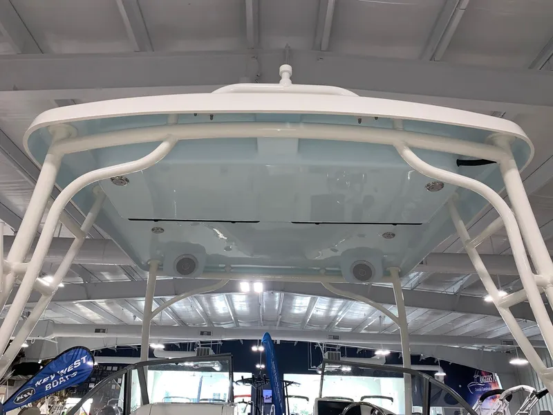 Slide: The Image of 2024 Key West 239 DFS boat under a covered display area. - 19
