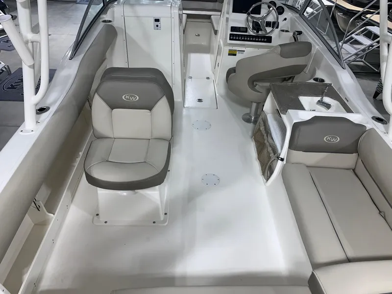 Slide: The Image of 2024 Key West 239 DFS boat interior with seating and helm station. - 22