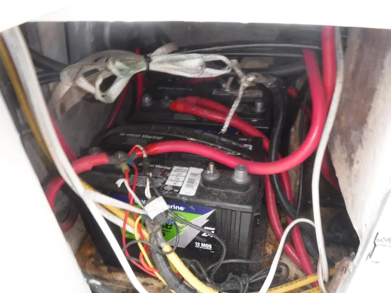 Slide: The Image of Battery compartment of a 1987 Custom Vansant 30 with wiring. - 23