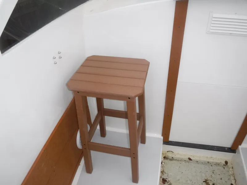 Slide: The Image of Wooden stool on the deck of a 1987 Custom Vansant 30 boat. - 29