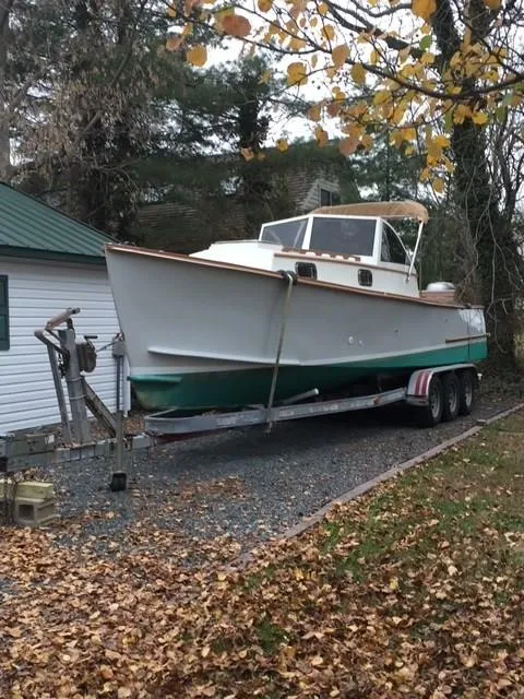 Slide: The Image of 1987 Custom Vansant 30 boat on a trailer in a wooded area. - 3