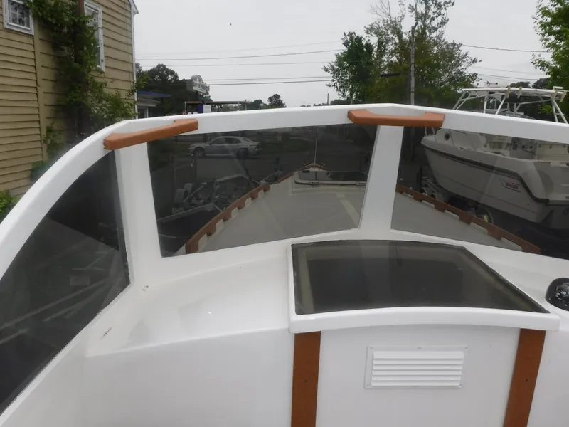 Slide: The Image of Custom Vansant 30 boat, 1987 model, white deck with windshield and wooden accents. - 30