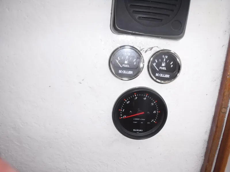 Slide: The Image of Gauges on a 1987 Custom Vansant 30 boat dashboard. - 35