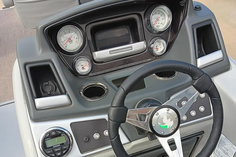 Slide: The Image of 2023 Ranger 223F boat dashboard with steering wheel and gauges. - 3