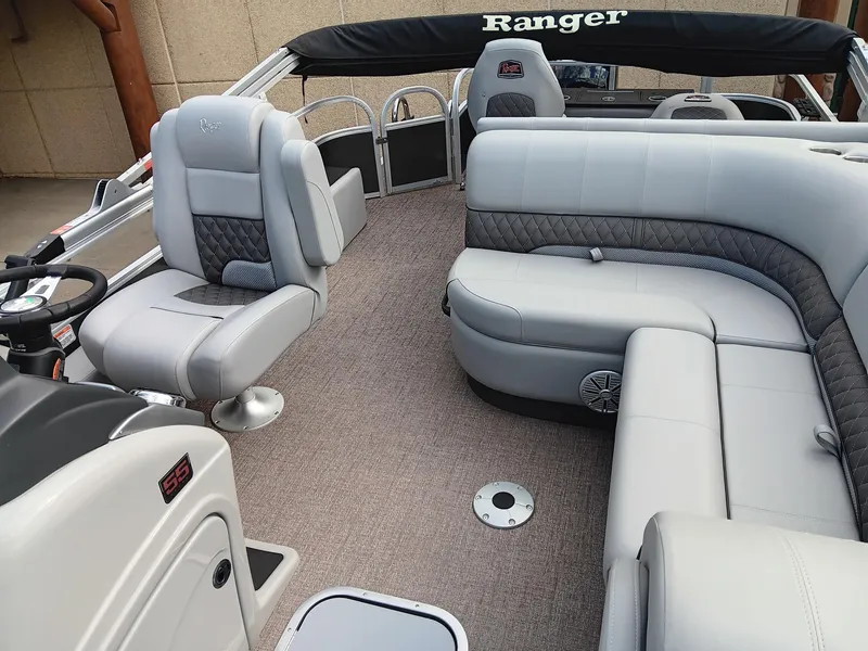 Slide: The Image of 2023 Ranger 223F boat interior with plush seating and modern design. - 4