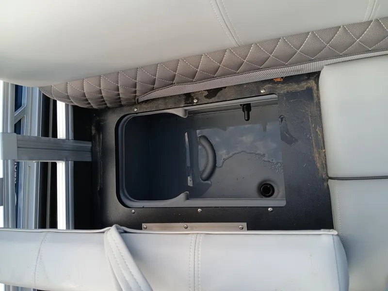 Slide: The Image of 2023 Ranger 223F boat seat storage compartment with gray upholstery. - 8