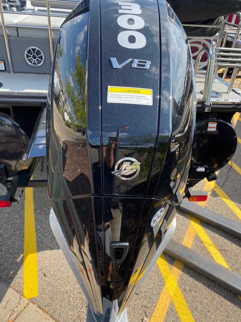 Slide: The Image of 2023 Regency 250 LE3 Sport boat with a 300 V8 outboard motor. - 2