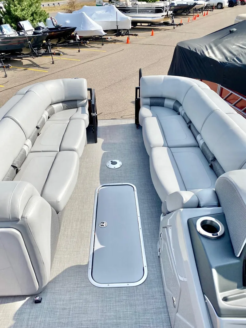 Slide: The Image of 2023 Regency 250 LE3 Sport pontoon boat with spacious seating and modern design. - 3