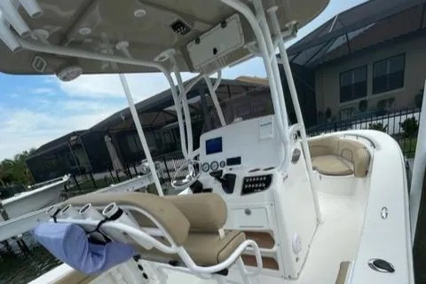 Slide: The Image of 2019 NauticStar 22 XS Offshore boat interior with helm station and seating. - 4