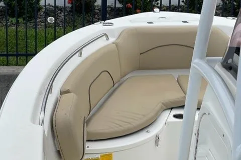 Slide: The Image of 2019 NauticStar 22 XS Offshore boat with beige cushioned seating. - 7