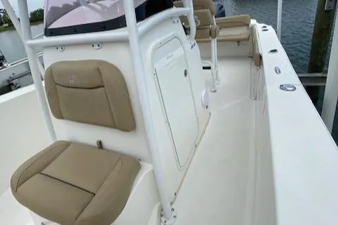 Slide: The Image of 2019 NauticStar 22 XS Offshore boat interior with tan seating and white deck. - 8