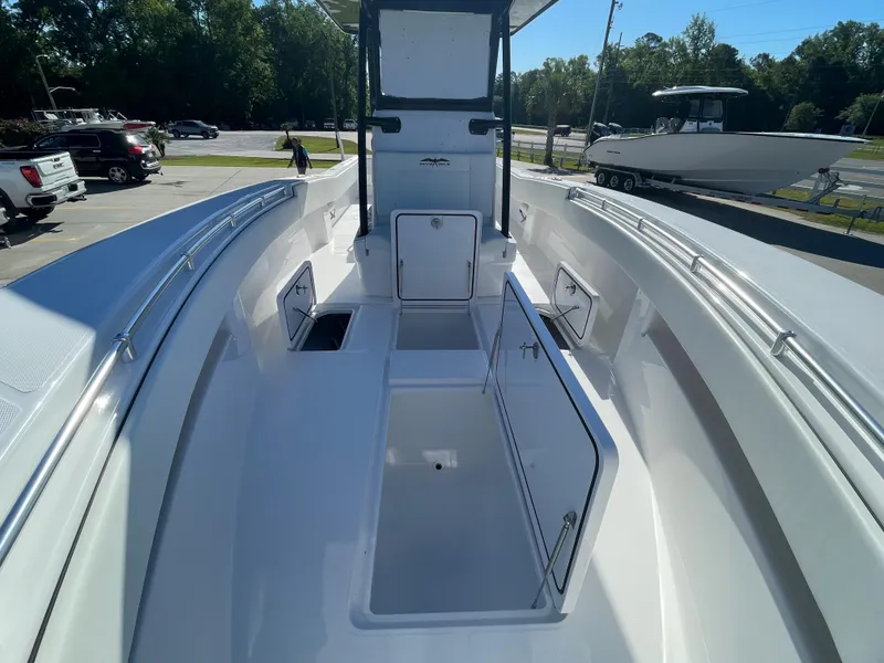 Slide: The Image of 2024 Invincible 33 Open Fisherman boat interior with storage compartments open. - 26