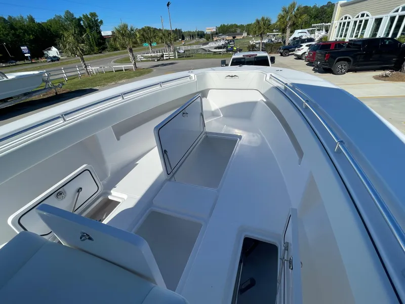 Slide: The Image of 2024 Invincible 33 Open Fisherman boat with open storage compartments. - 28