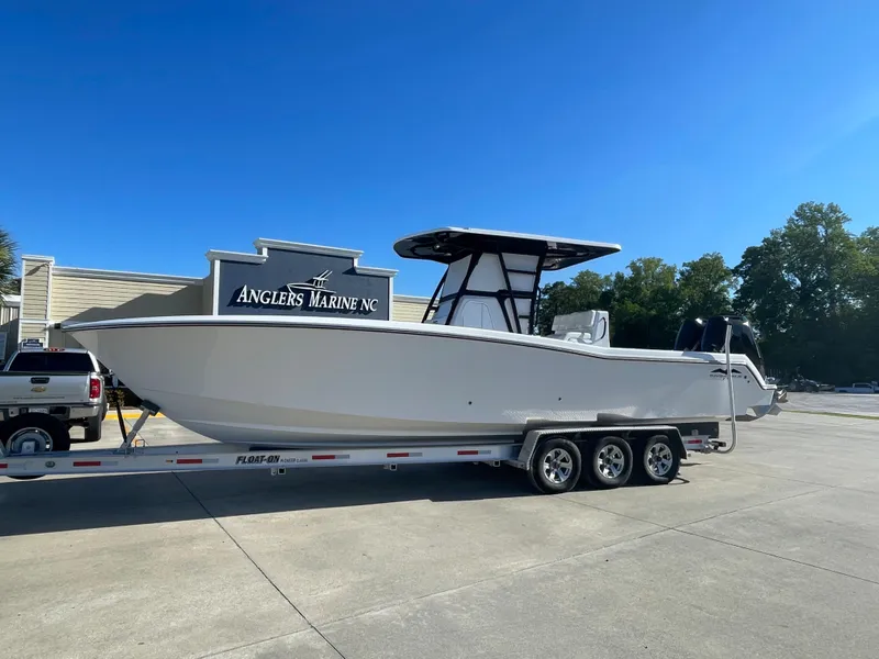 Slide: The Image of 2024 Invincible 33 Open Fisherman boat on trailer at Angler's Marine NC. - 1