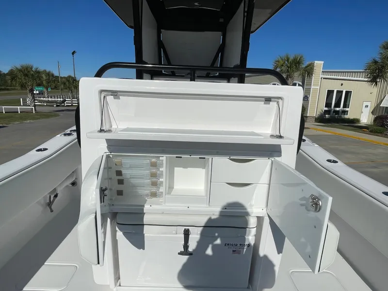 Slide: The Image of 2024 Invincible 33 Open Fisherman boat with open storage compartments. - 11
