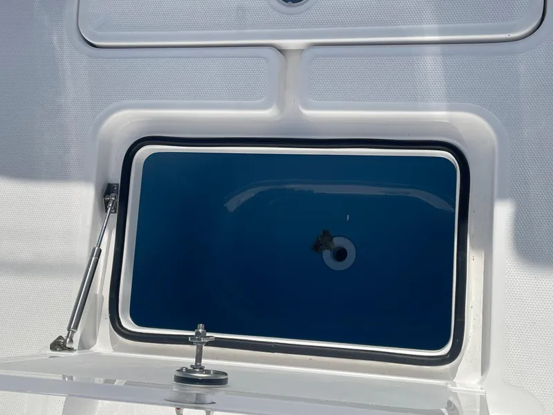 Slide: The Image of 2024 Invincible 33 Open Fisherman livewell compartment. - 16