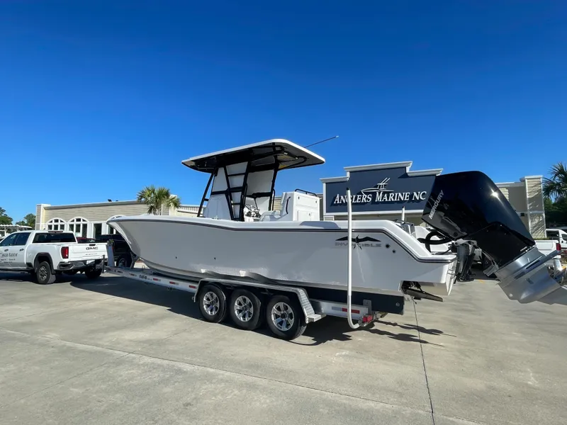 Slide: The Image of 2024 Invincible 33 Open Fisherman boat on a trailer at Anglers Marine. - 2