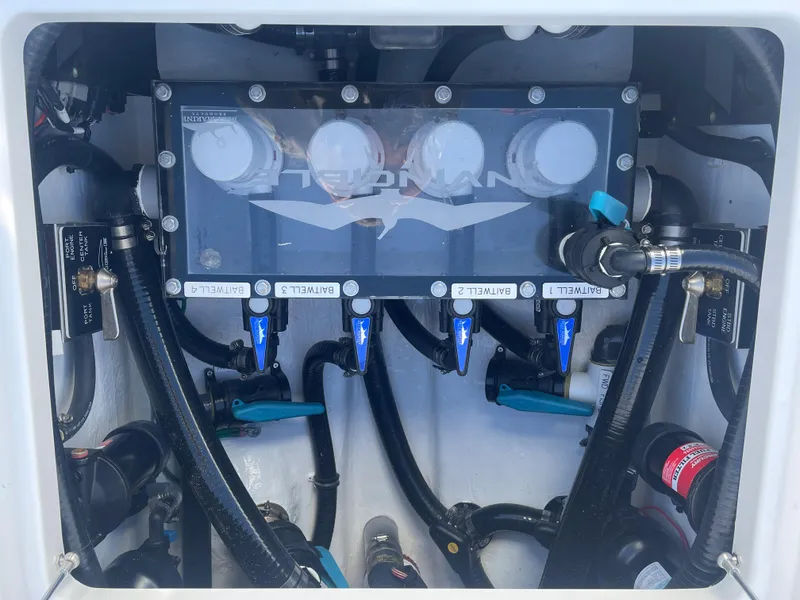 Slide: The Image of 2024 Invincible 33 Open Fisherman engine compartment with hydraulic system. - 20