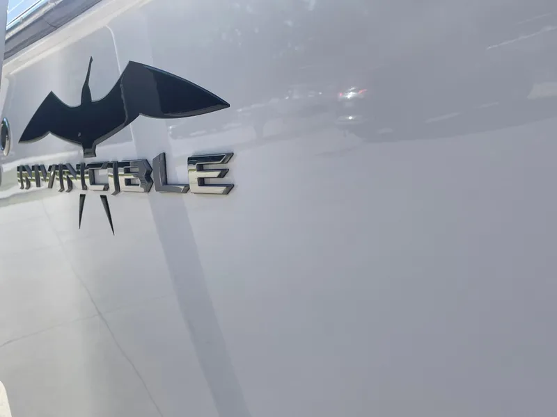 Slide: The Image of 2024 Invincible 33 Open Fisherman boat logo on hull. - 6