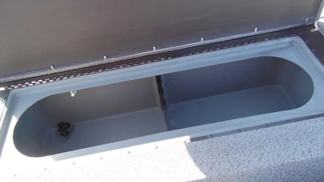 Slide: The Image of 2023 G3 Sportsman 1610 storage compartment with open lid. - 13