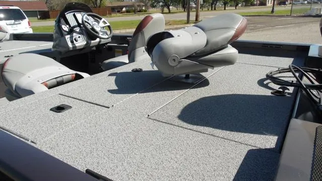 Slide: The Image of 2023 G3 Sportsman 1610 boat interior with seating and steering console. - 5