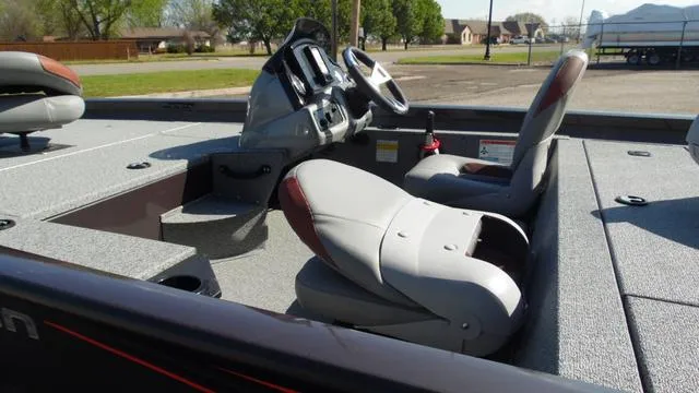 Slide: The Image of 2023 G3 Sportsman 1610 boat interior with steering console and seating. - 6