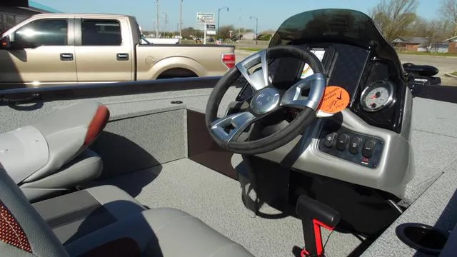 Slide: The Image of 2023 G3 Sportsman 1610 boat interior with steering wheel and control panel. - 8