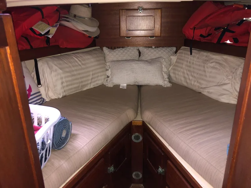 Slide: The Image of 1963 Egg Harbor Convertible Cruiser cabin with twin beds and storage. - 21