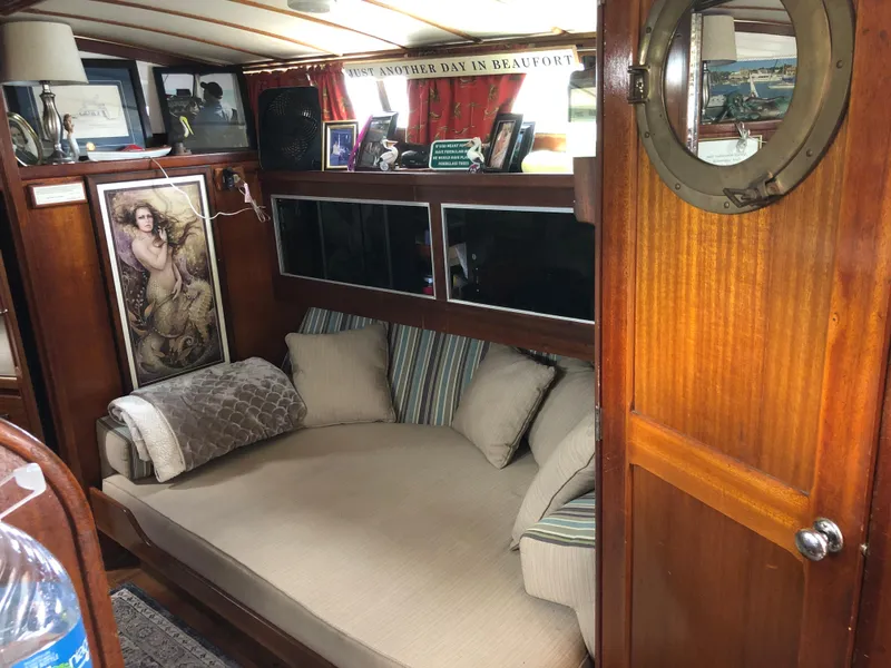 Slide: The Image of 1963 Egg Harbor Convertible Cruiser interior with cozy seating and nautical decor. - 22