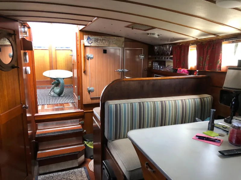 Slide: The Image of Interior of a 1963 Egg Harbor Convertible Cruiser with striped seating and wooden finishes. - 26