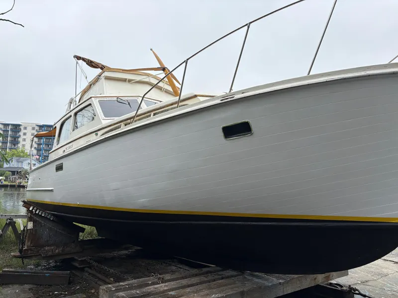 Slide: The Image of 1963 Egg Harbor Convertible Cruiser on dry dock, showcasing classic design and craftsmanship. - 4