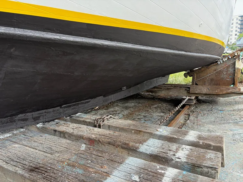 Slide: The Image of 1963 Egg Harbor Convertible Cruiser on dry dock, showcasing hull and keel. - 6