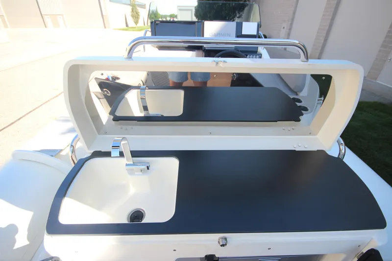Slide: The Image of 2024 Zodiac MEDLINE 9 NEO boat with sink and countertop, showcasing modern design. - 16