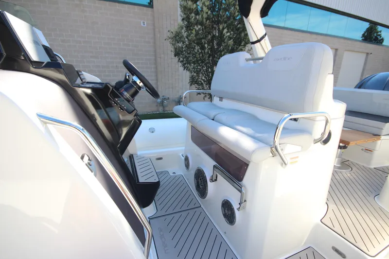 Slide: The Image of 2024 Zodiac MEDLINE 9 NEO boat interior with steering wheel and seating area. - 18