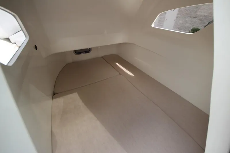 Slide: The Image of 2024 Zodiac MEDLINE 9 NEO Twin 300hp cabin interior with beige cushions. - 20