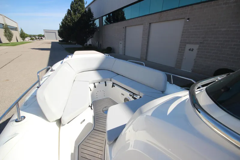 Slide: The Image of 2024 Zodiac MEDLINE 9 NEO boat with spacious seating, docked near industrial buildings. - 27