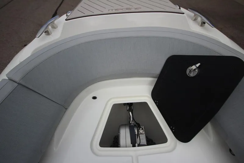 Slide: The Image of 2024 Zodiac MEDLINE 9 NEO Twin 300hp boat interior with storage compartment. - 29