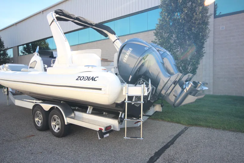 Slide: The Image of 2024 Zodiac MEDLINE 9 NEO boat with twin 300hp engines on trailer, parked outdoors. - 6